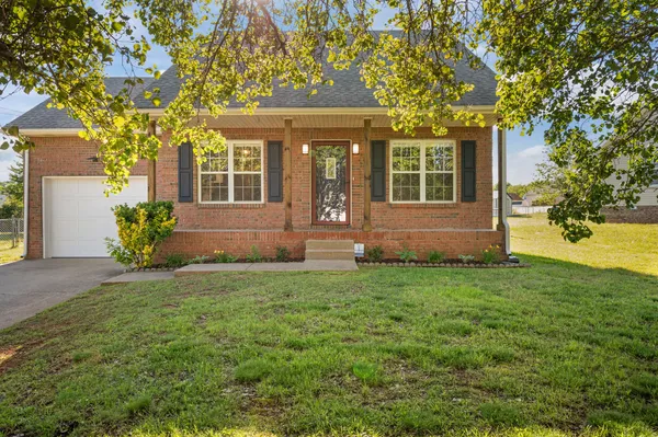 front view of a house with a yard