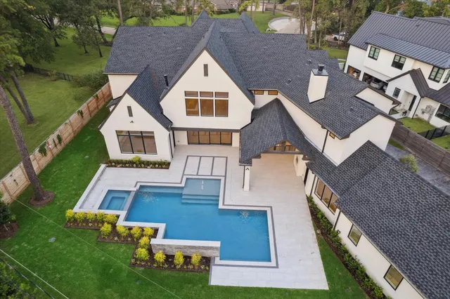 an aerial view of house with yard