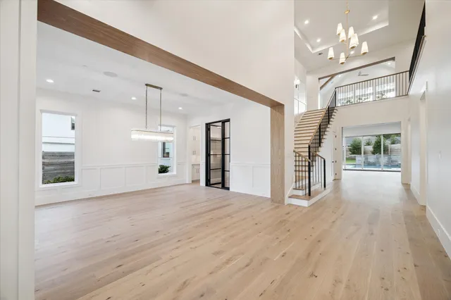 a bathroom with a granite countertop sink a shower and mirror
