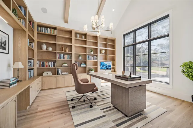 a living room with furniture wooden floor and a flat screen tv