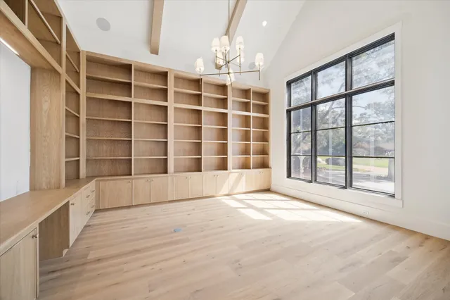a kitchen with stainless steel appliances a refrigerator sink and cabinets