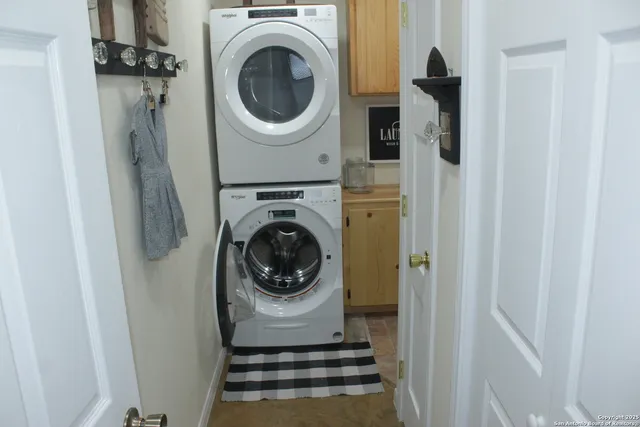 a view of a hallway with washer and dryer