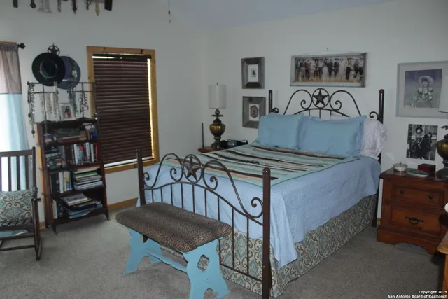 a bedroom with furniture and a bed