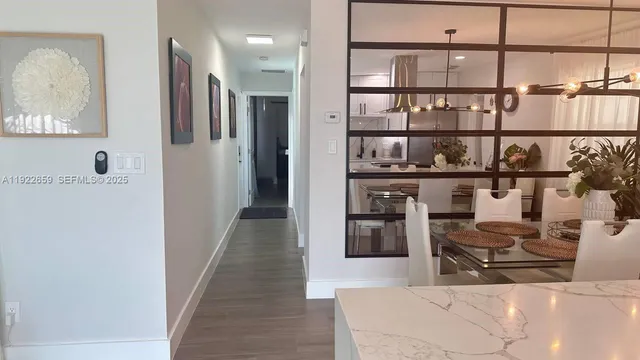 a view of a living room and kitchen with furniture