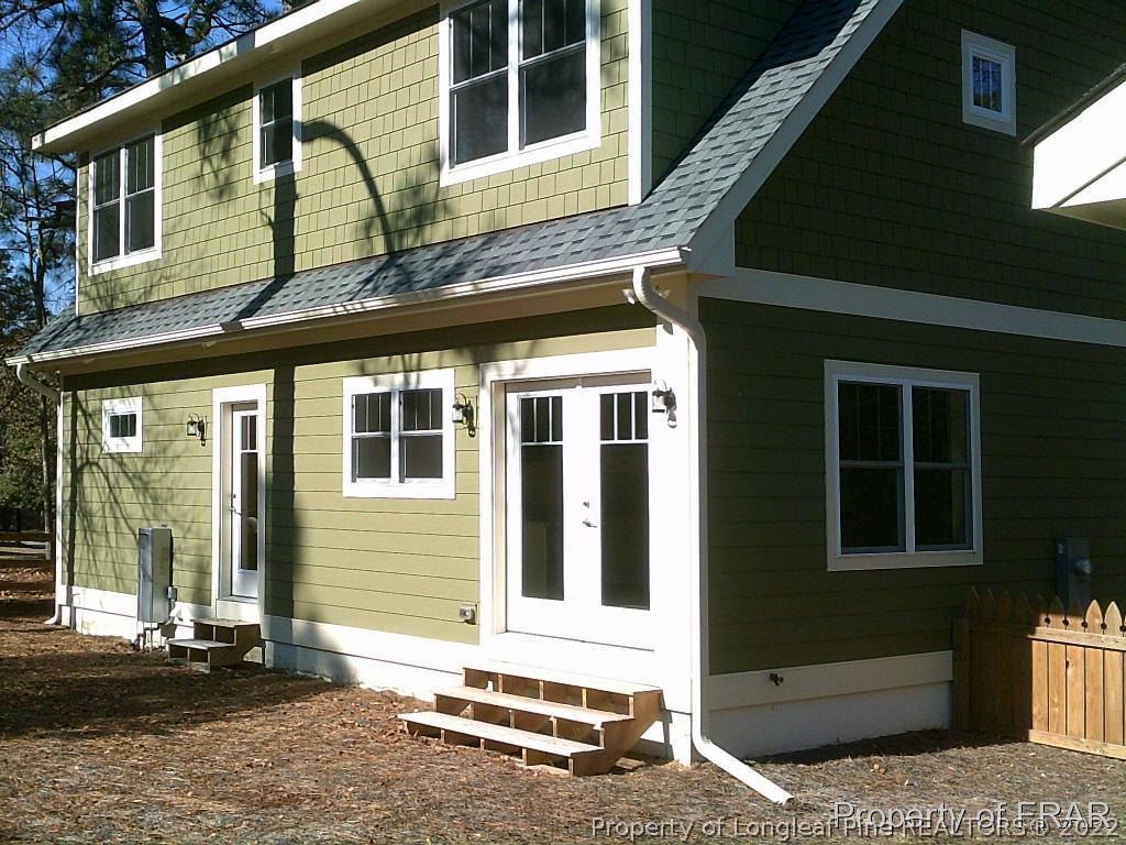 4015 Youngs Road Southern Pines, NC 28387 - Photo 22 of 25 a front view of a house with a yard