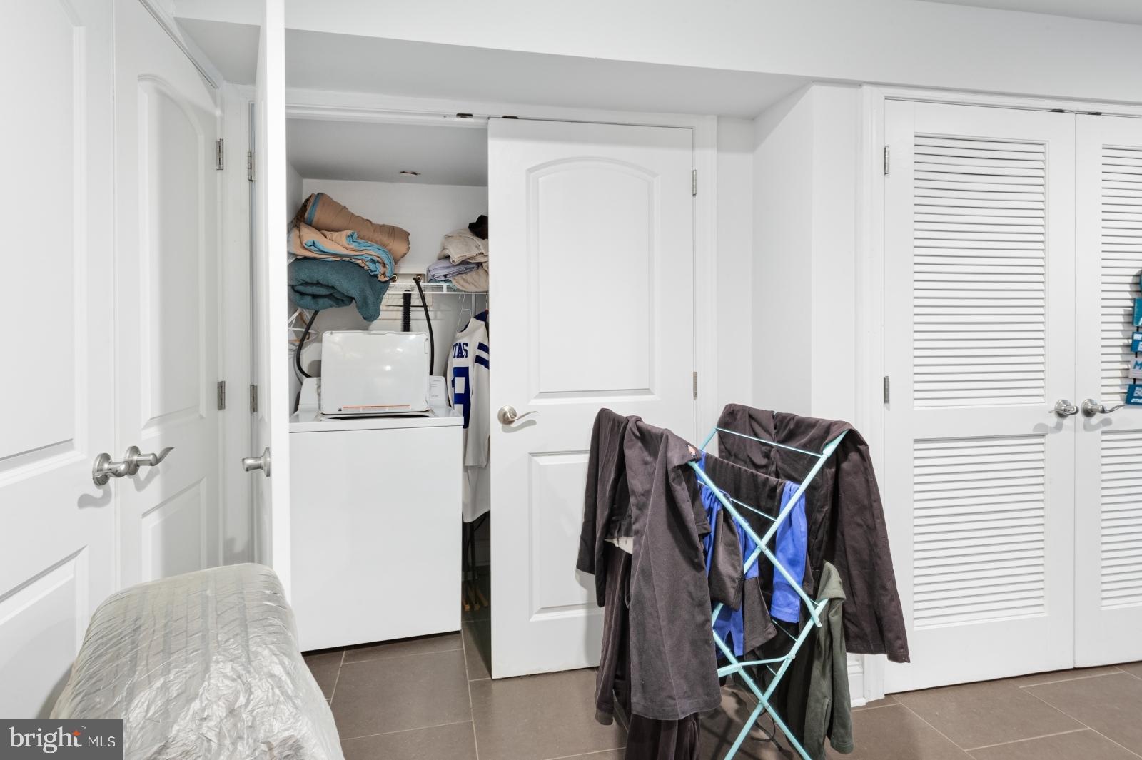 2629 Cedar Street Philadelphia, PA 19125 - Photo 12 of 30 a view of walk in closet with clothes and shoes