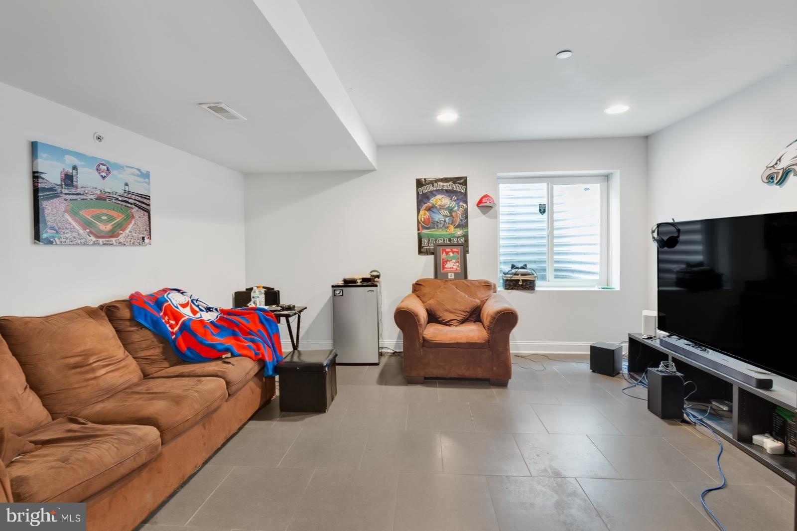 2629 Cedar Street Philadelphia, PA 19125 - Photo 13 of 30 a living room with furniture and a flat screen tv