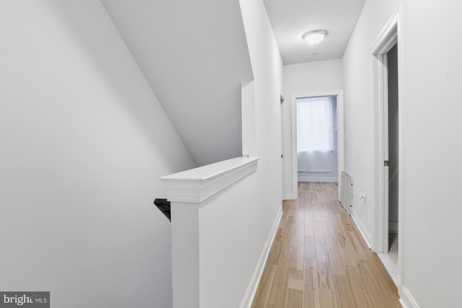 2629 Cedar Street Philadelphia, PA 19125 - Photo 15 of 30 a view of a hallway with wooden floor and staircase