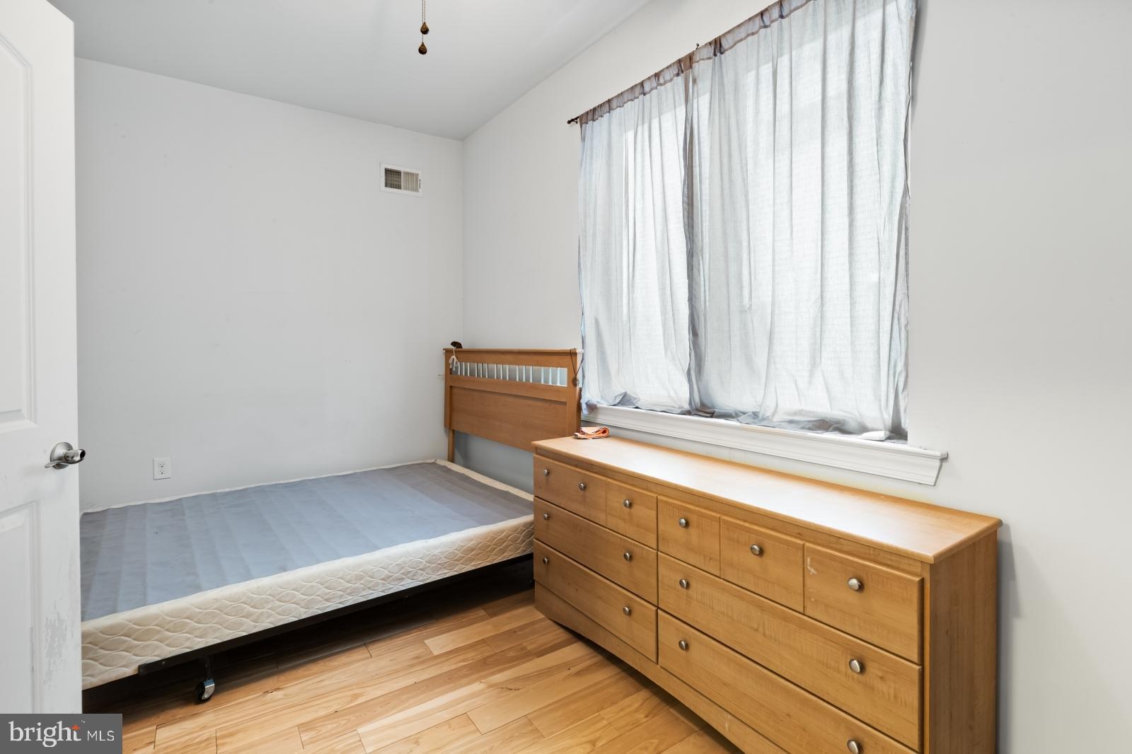 2629 Cedar Street Philadelphia, PA 19125 - Photo 16 of 30 a room with a bed and a window