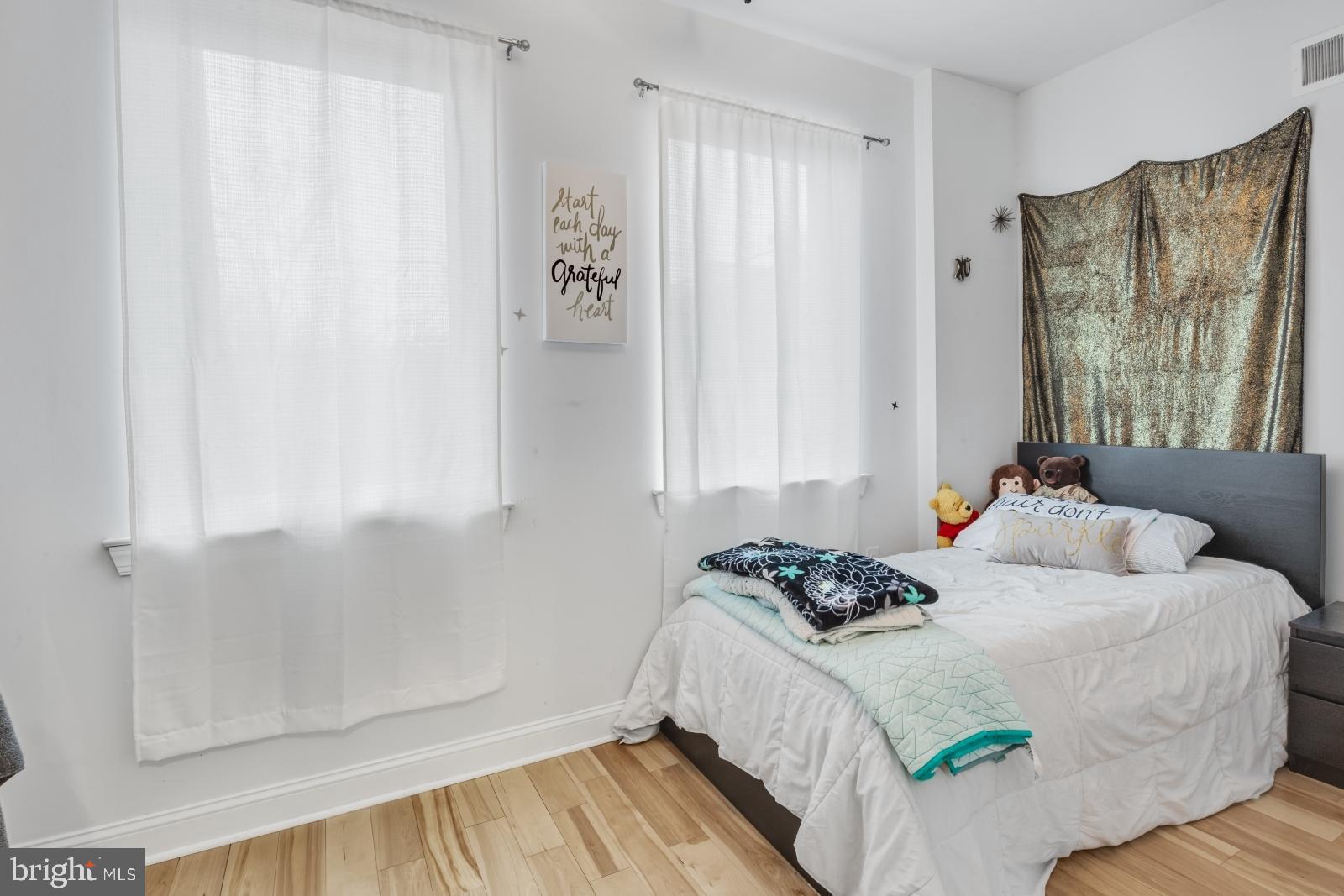 2629 Cedar Street Philadelphia, PA 19125 - Photo 20 of 30 a bedroom with a bed and a window