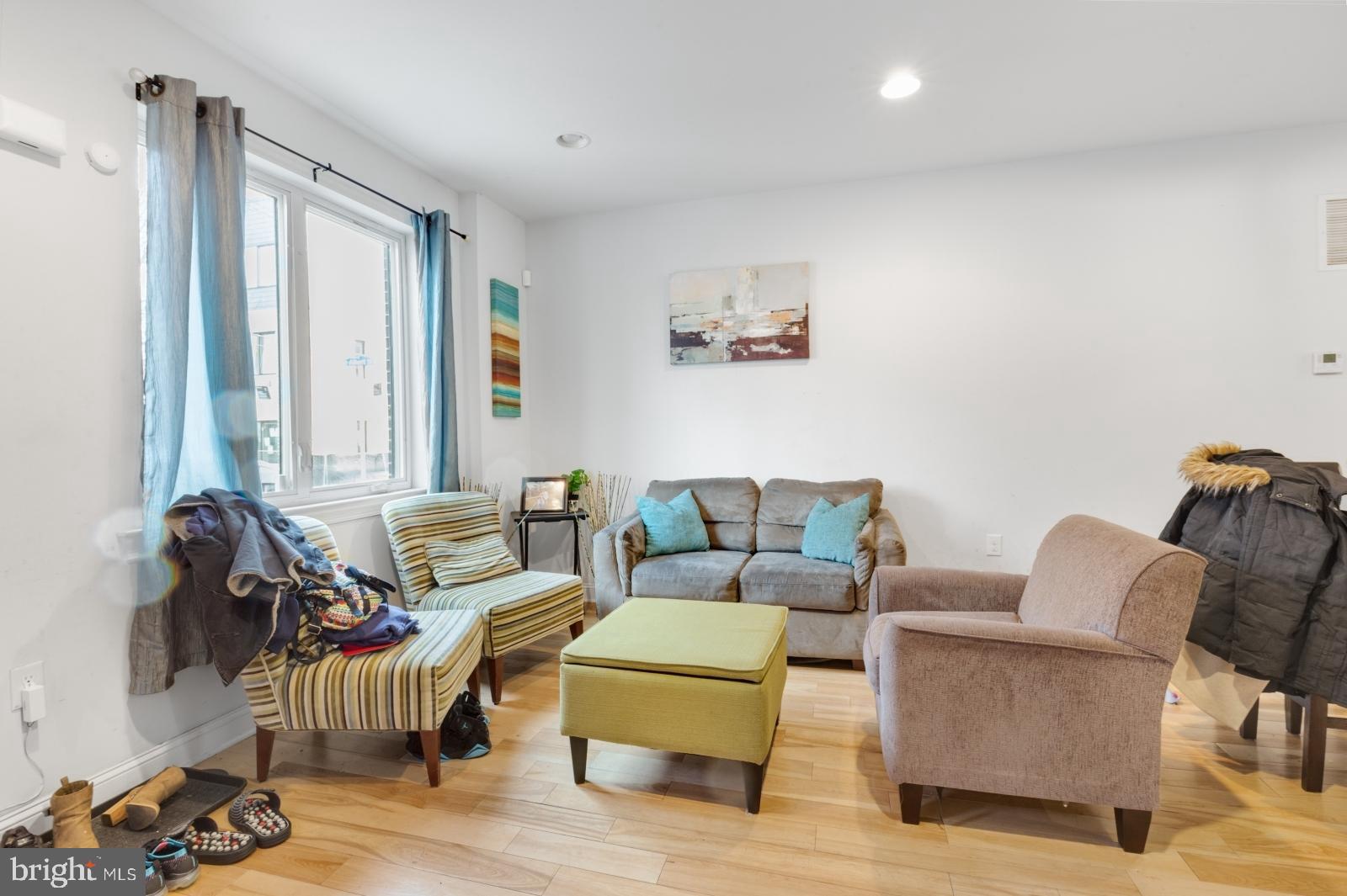 2629 Cedar Street Philadelphia, PA 19125 - Photo 2 of 30 a living room with furniture and a large window