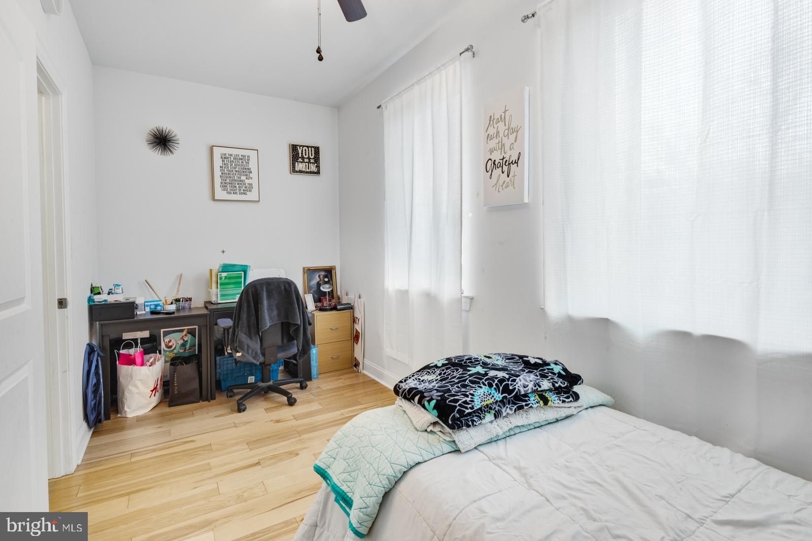 2629 Cedar Street Philadelphia, PA 19125 - Photo 22 of 30 a bedroom with a bed and a wooden floor