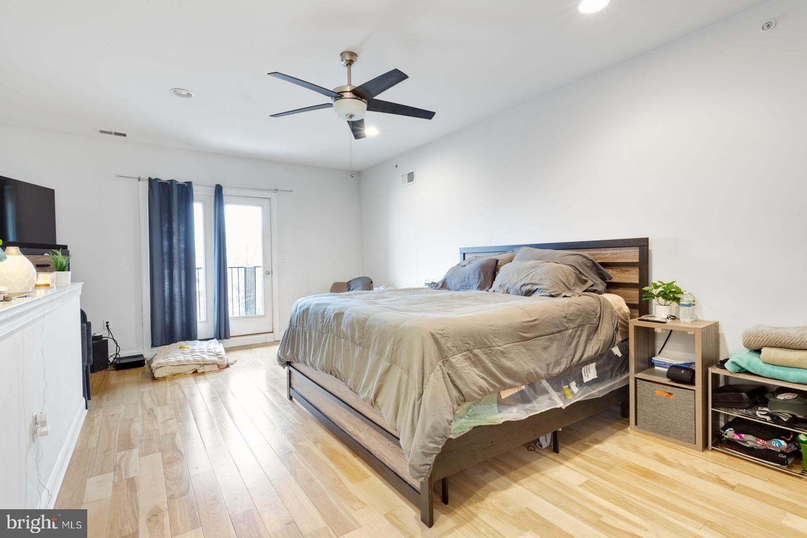 2629 Cedar Street Philadelphia, PA 19125 - Photo 23 of 30 a bedroom with a bed and wooden floor
