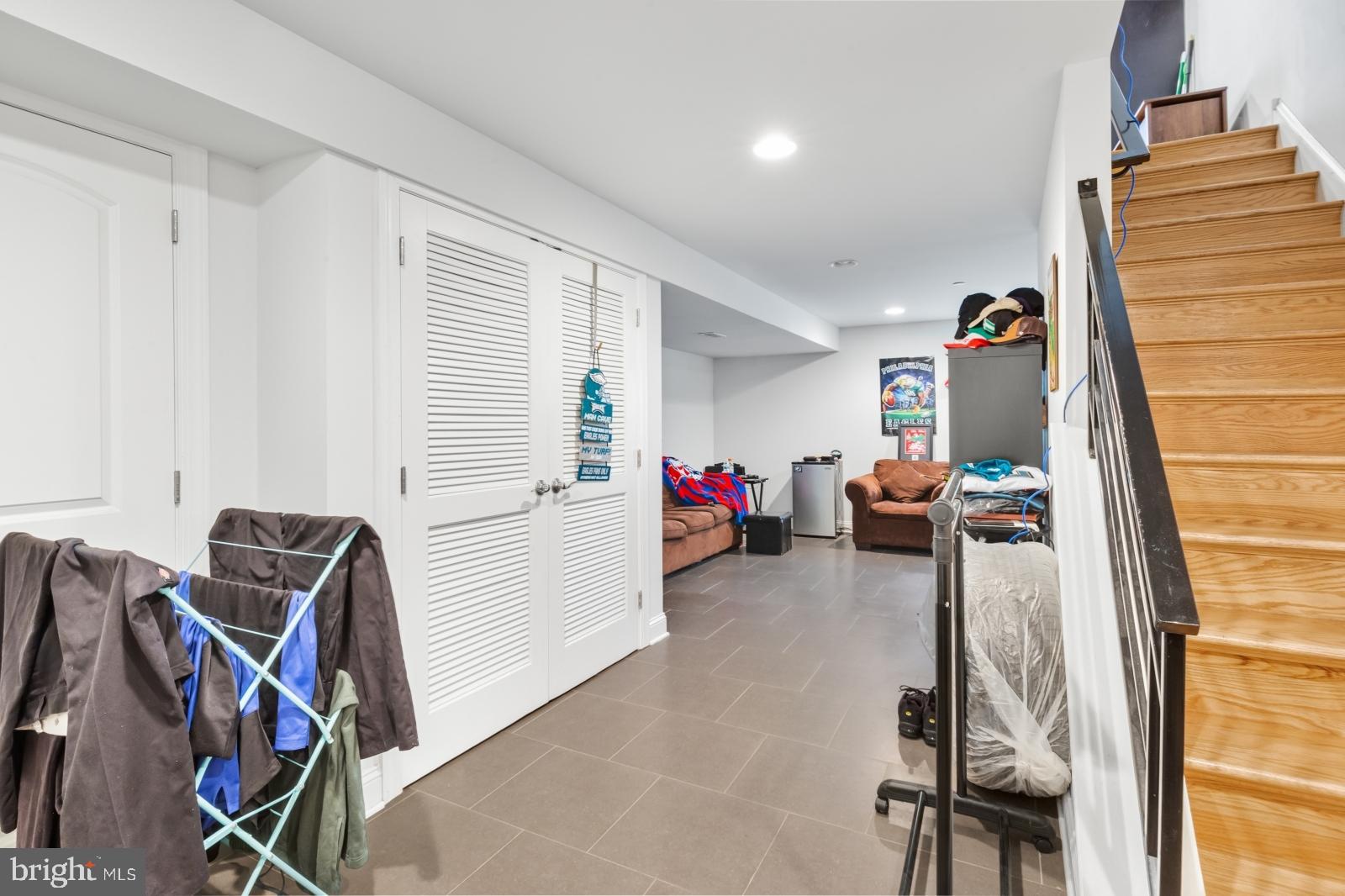 2629 Cedar Street Philadelphia, PA 19125 - Photo 10 of 30 a living room with furniture a flat screen tv and a window