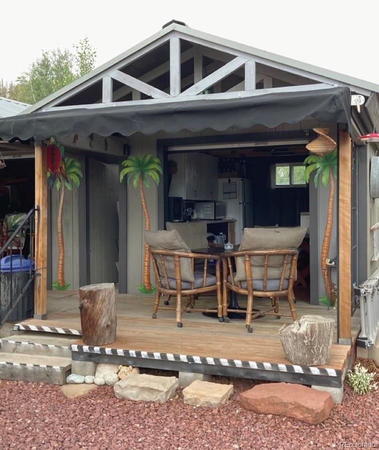 44 Clubcar Road Fairplay, CO 80440 - Photo 6 of 13 a view of a wooden chairs and table in the patio