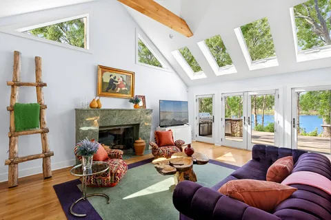 a view of a living room and furniture from window