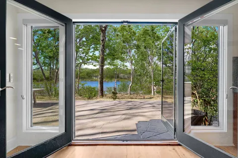 a view of a patio with a table and chairs