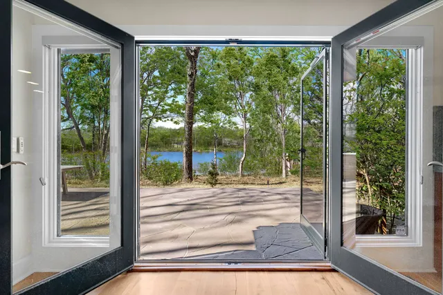 a view of a patio with a table and chairs