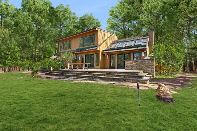 a house view with a sitting space garden view