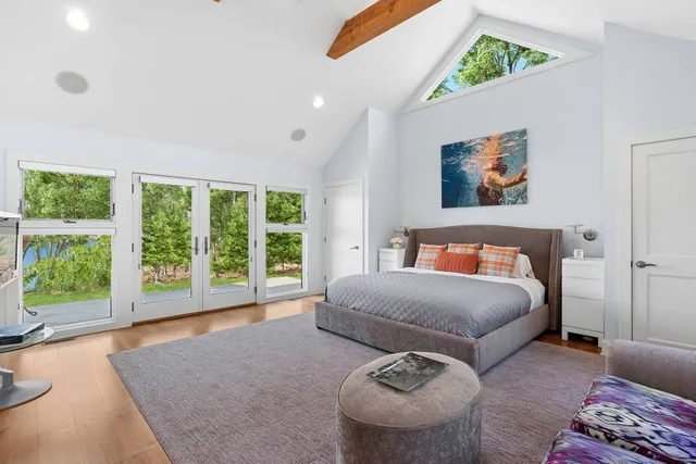 a bathroom with a shower sink and mirror