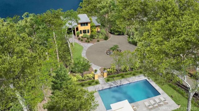 a view of a swimming pool with an outdoor space and seating area