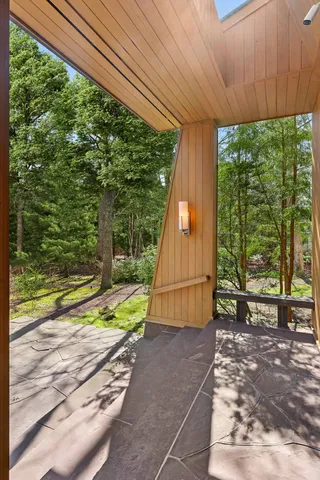 a pathway of a house with a yard