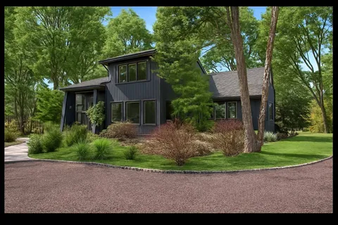 a aerial view of a house with pool yard and outdoor seating