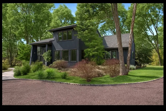 a aerial view of a house with pool yard and outdoor seating