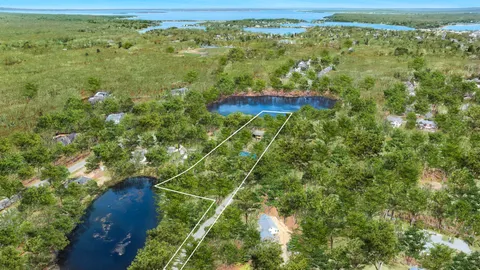 a living room with fireplace furniture and a large window