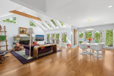 a bed room with a bed and a chair