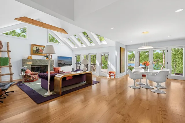 a bed room with a bed and a chair