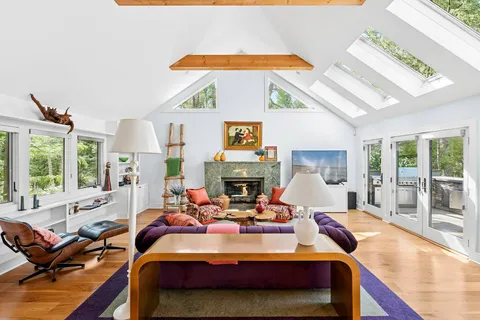 a large kitchen with stainless steel appliances granite countertop a stove a sink and a refrigerator