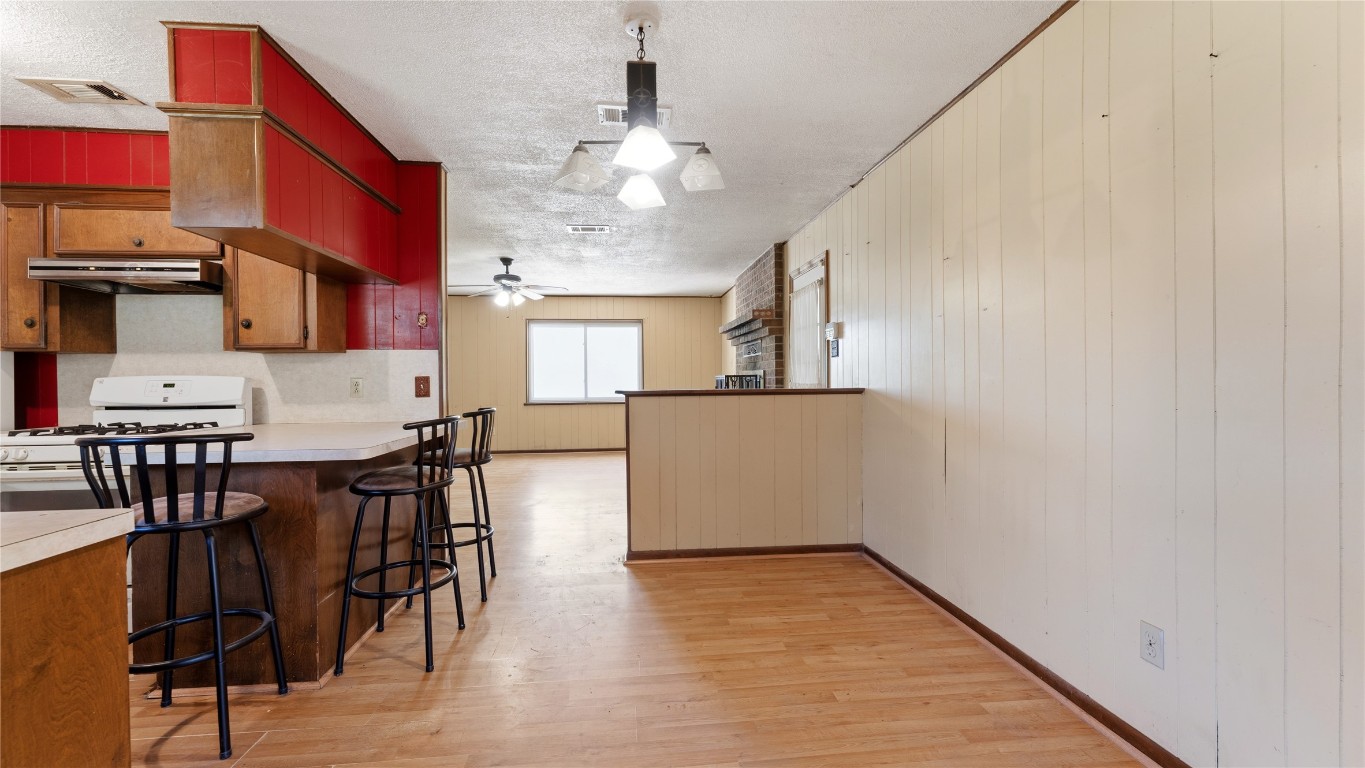 187 Watson Lake Road Huntsville, TX 77340 - Photo 13 of 25 a view of a dining room with furniture and chandelier