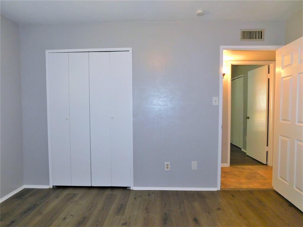 421 Shadowcrest Lane Coppell, TX 75019 - Photo 16 of 22 a view of room with wooden floor and closet