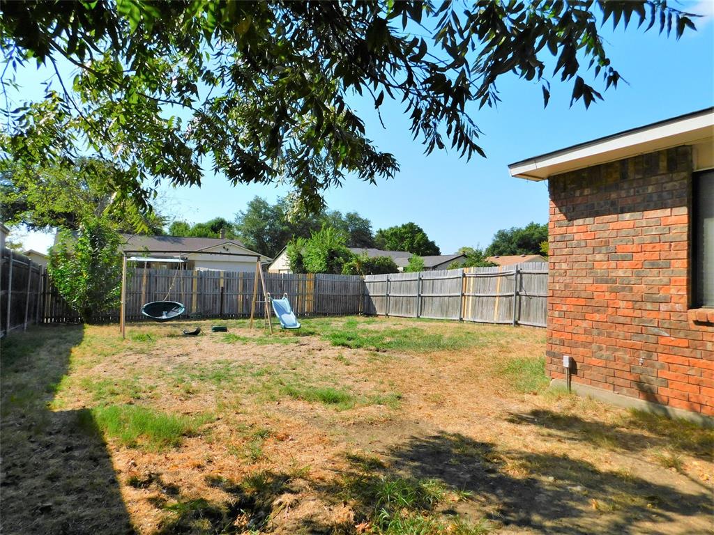 421 Shadowcrest Lane Coppell, TX 75019 - Photo 21 of 22 a backyard of a house with table and chairs
