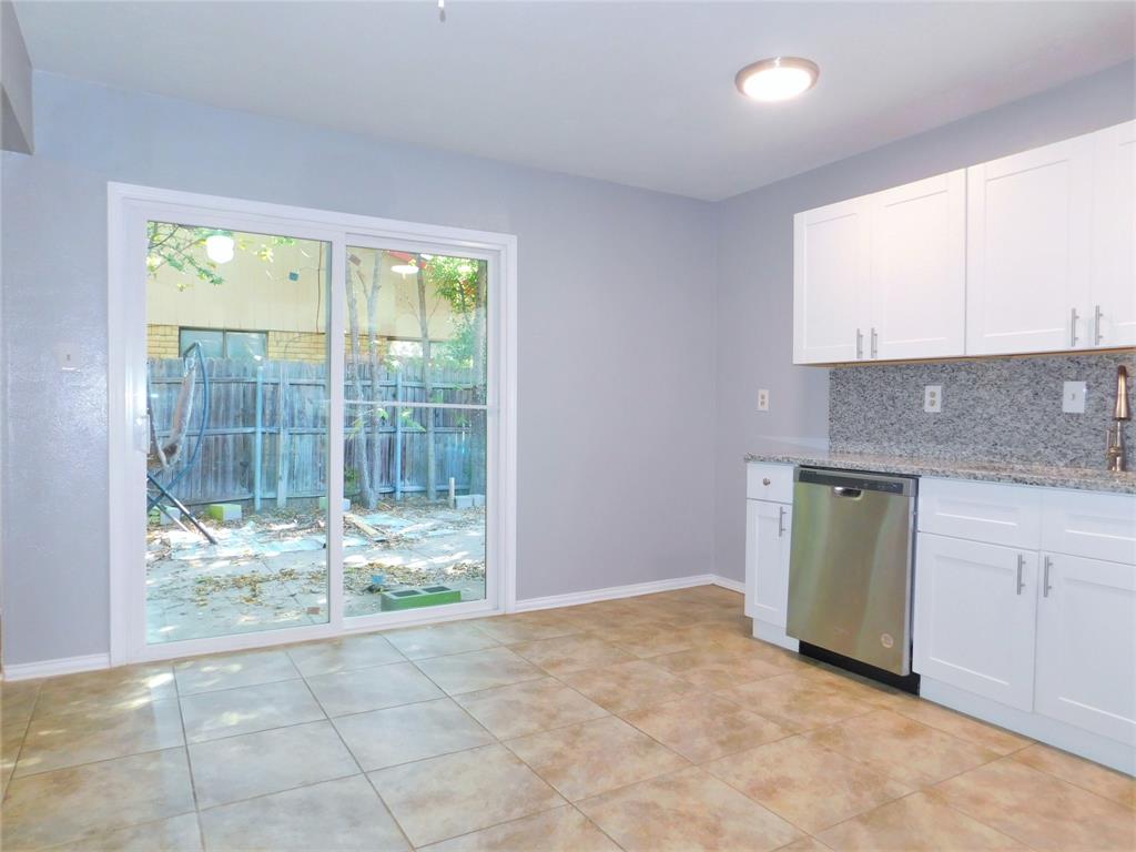 421 Shadowcrest Lane Coppell, TX 75019 - Photo 8 of 22 a view of a kitchen with a sink and cabinets