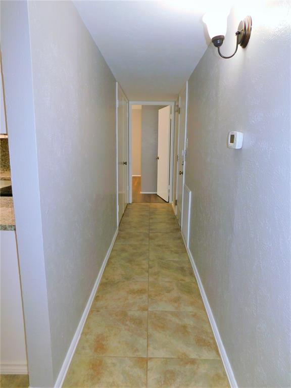 421 Shadowcrest Lane Coppell, TX 75019 - Photo 9 of 22 a view of a hallway with wooden floor