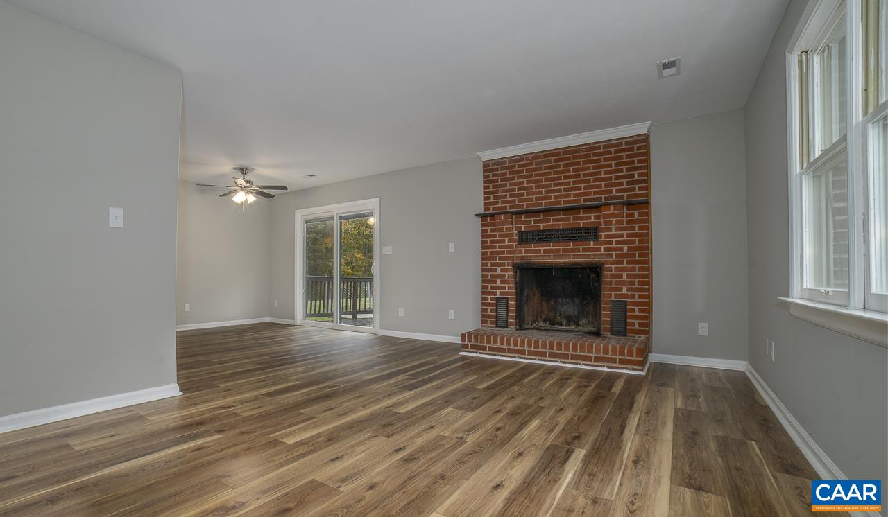 3660 Union Church Road Buckingham, VA 23921 - Photo 11 of 25 a view of an empty room with wooden floor fireplace and a window
