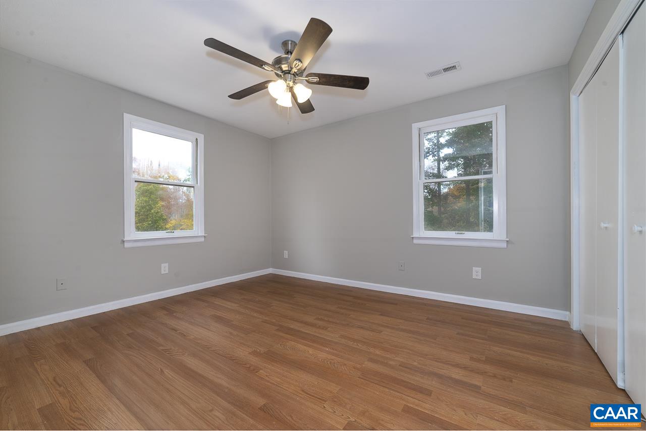 3660 Union Church Road Buckingham, VA 23921 - Photo 15 of 25 a view of an empty room with wooden floor and a window