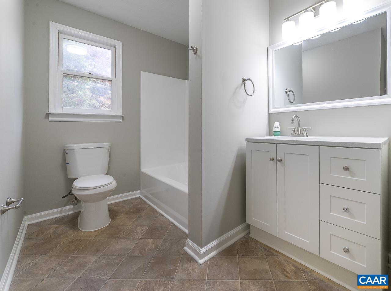3660 Union Church Road Buckingham, VA 23921 - Photo 18 of 25 a bathroom with a toilet a sink and a mirror