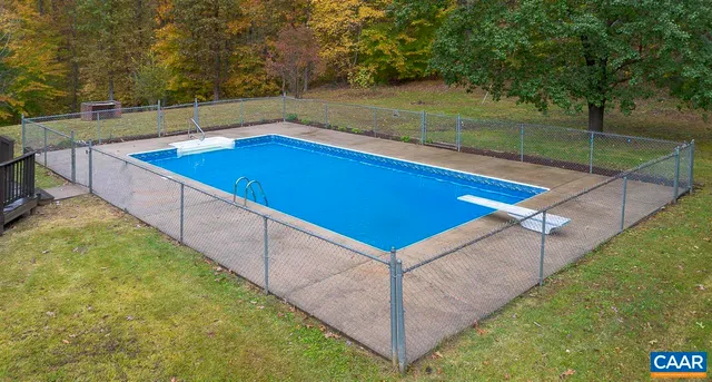 a view of a backyard with pool