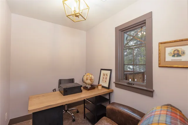 a view of a workspace with furniture