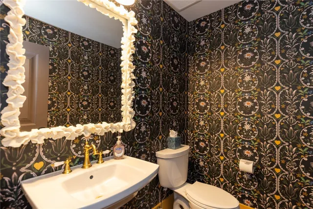 a bathroom with a toilet and sink