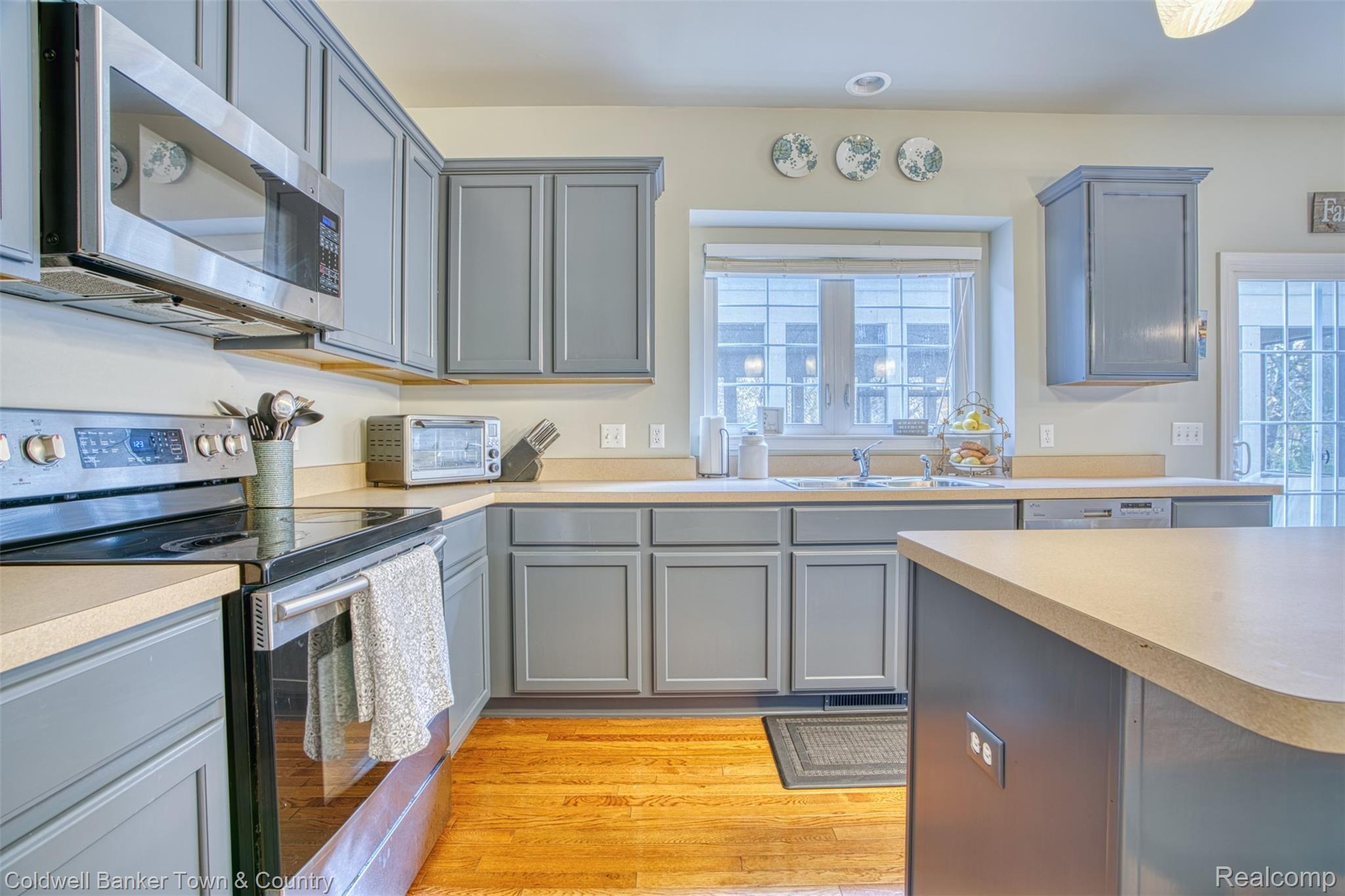 4160 Merriman Loop Howell, MI 48843 - Photo 11 of 38 Lots of cabinet space in the kitchen!