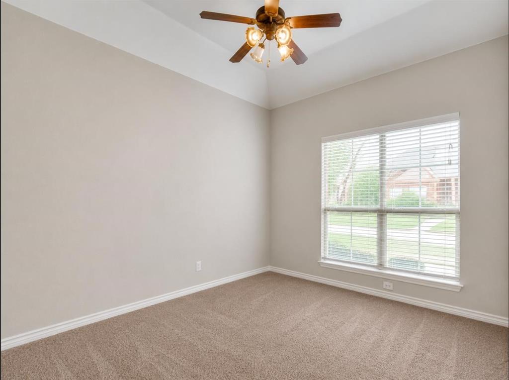 9962 Bell Rock Road Frisco, TX 75035 - Photo 19 of 28 an empty room with a window and a fan