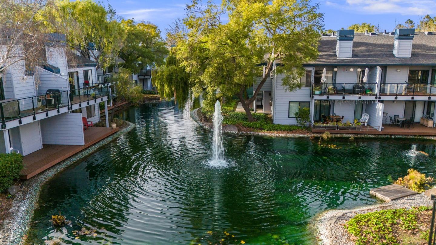 905 West Middlefield Road, Unit 923 Mountain View, CA 94043 - Photo 30 of 38 a view of a lake with a house