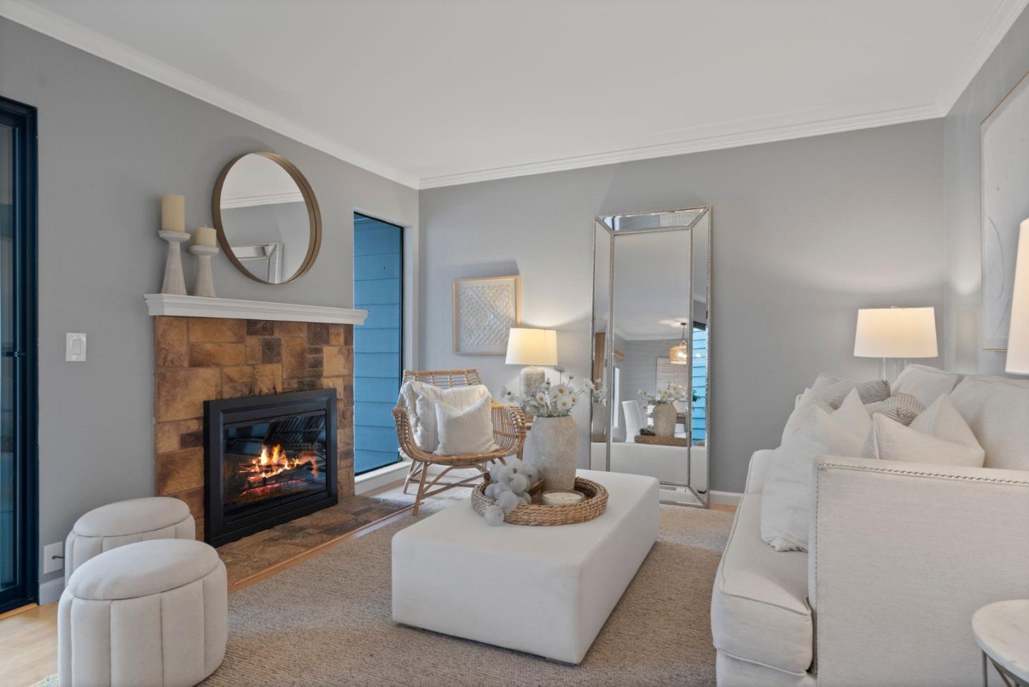 905 West Middlefield Road, Unit 923 Mountain View, CA 94043 - Photo 3 of 38 a living room with furniture a fireplace and a fireplace