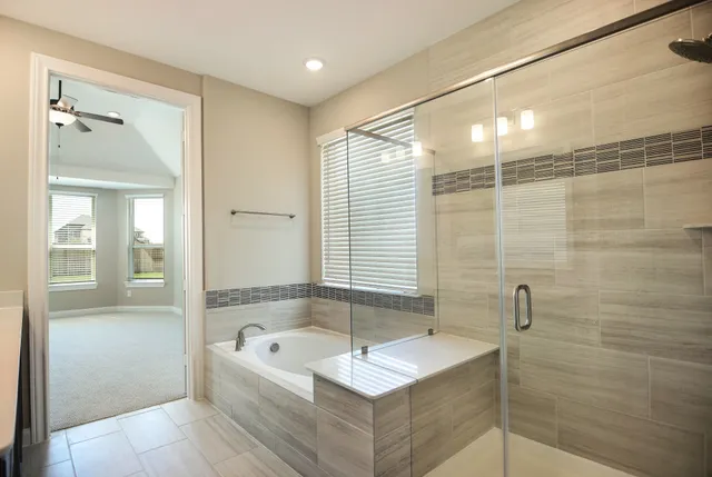 a bathroom with a bathtub and a sink