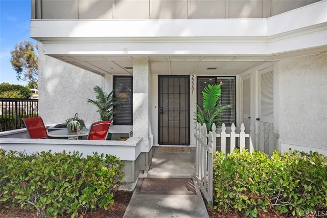 a balcony with furniture and a potted plant