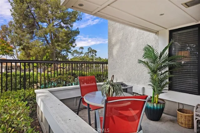 a front view of a house with a flower garden
